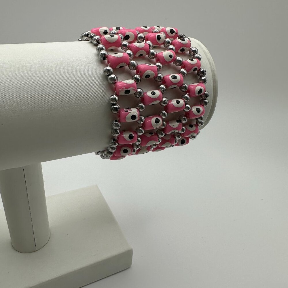 Super comfy pink and white stretch “evil eye” good luck bracelet.